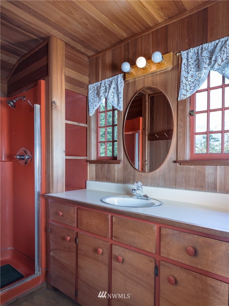 1428 Aleck Bay Road Lopez Island, WA 98261 - Photo 17 of 30 a bathroom with a sink and a mirror