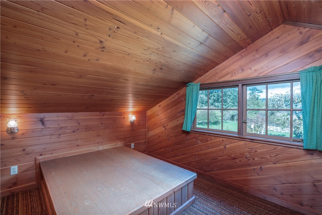 1428 Aleck Bay Road Lopez Island, WA 98261 - Photo 19 of 30 a view of an empty room with a window