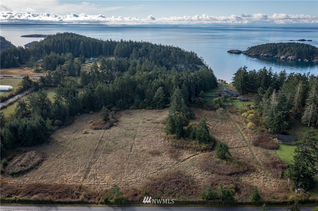 1428 Aleck Bay Road Lopez Island, WA 98261 - Photo 20 of 30 a view of a lake with beach and outdoor space