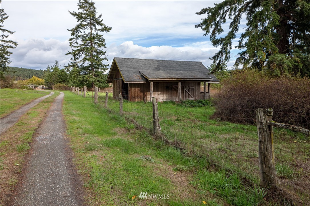 1428 Aleck Bay Road Lopez Island, WA 98261 - Photo 24 of 30 a view of a house with a backyard