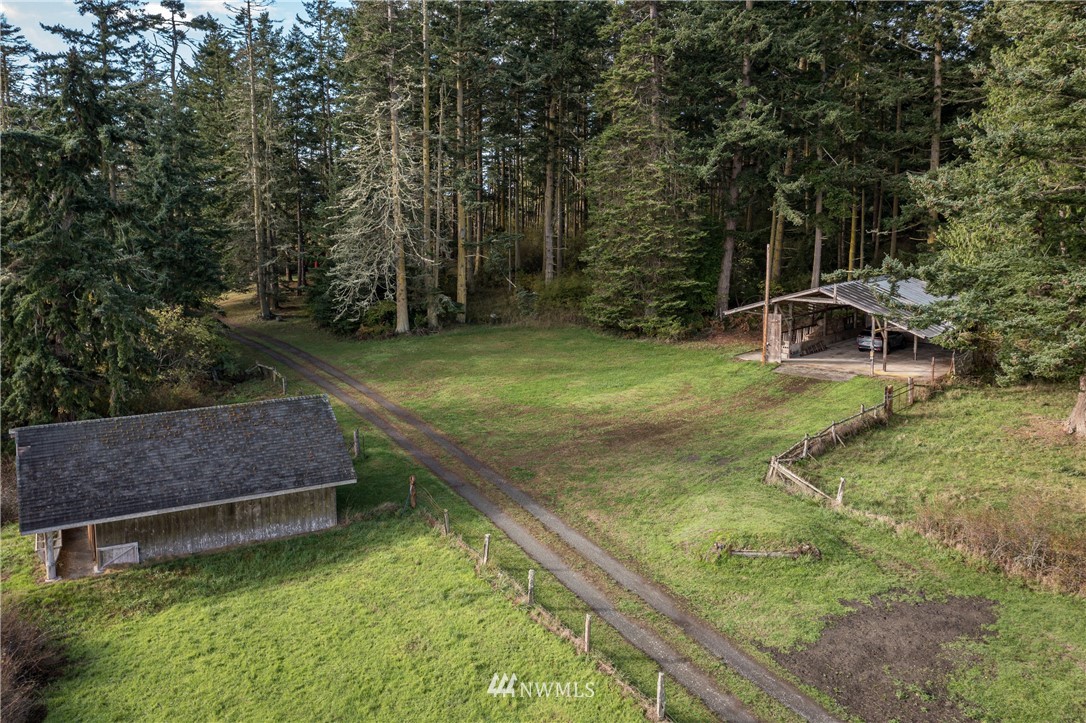 1428 Aleck Bay Road Lopez Island, WA 98261 - Photo 25 of 30 a view of a backyard with swimming pool