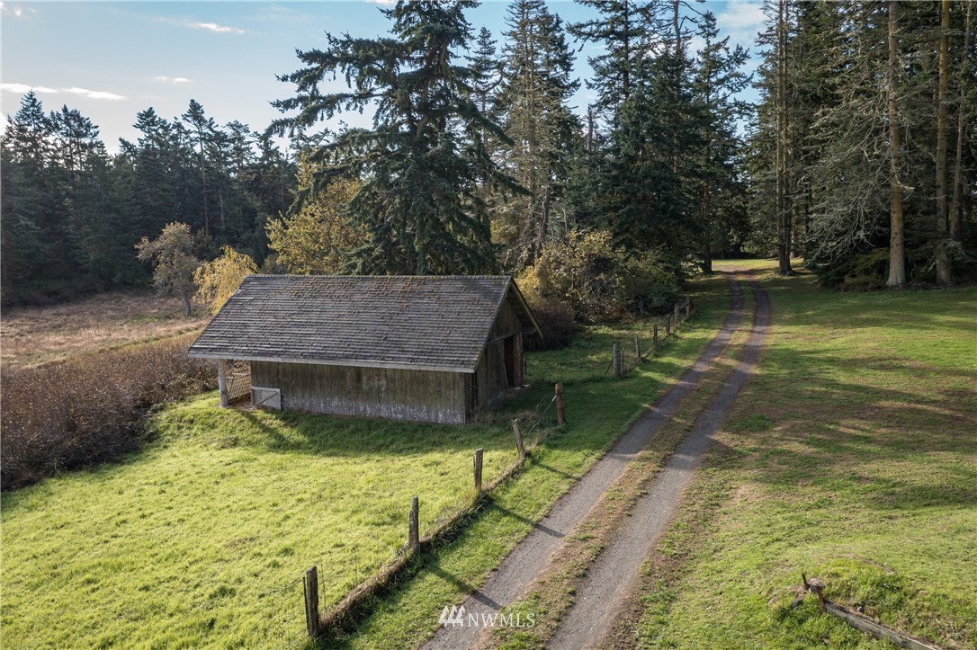 1428 Aleck Bay Road Lopez Island, WA 98261 - Photo 26 of 30 a small pool with a yard in the back