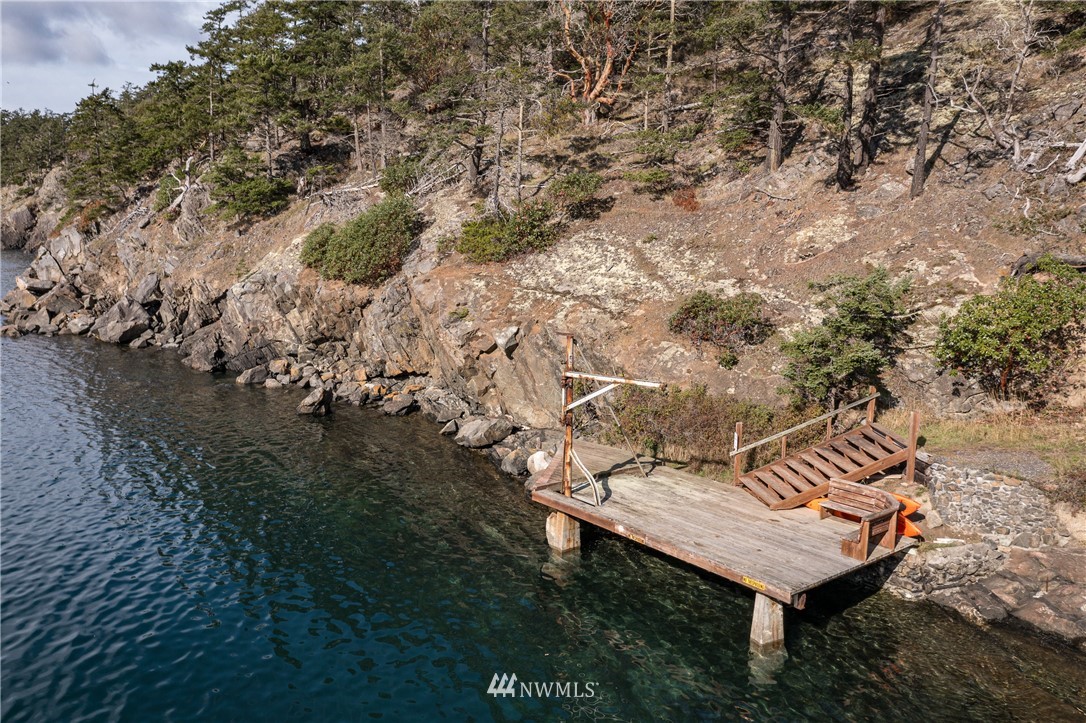 1428 Aleck Bay Road Lopez Island, WA 98261 - Photo 27 of 30 a view of a backyard with sitting area