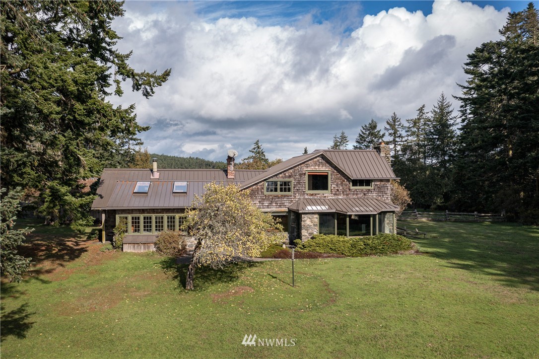 1428 Aleck Bay Road Lopez Island, WA 98261 - Photo 29 of 30 a front view of a house with a garden