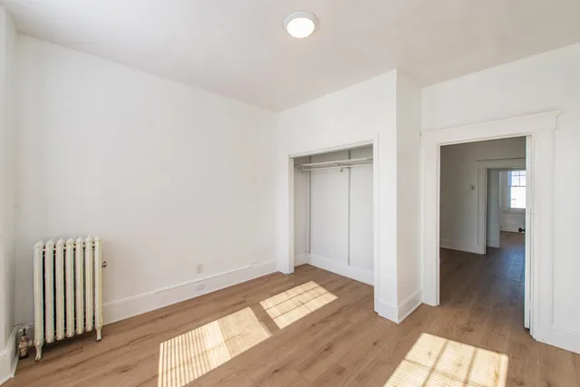 wooden floor in a hall with an entryway