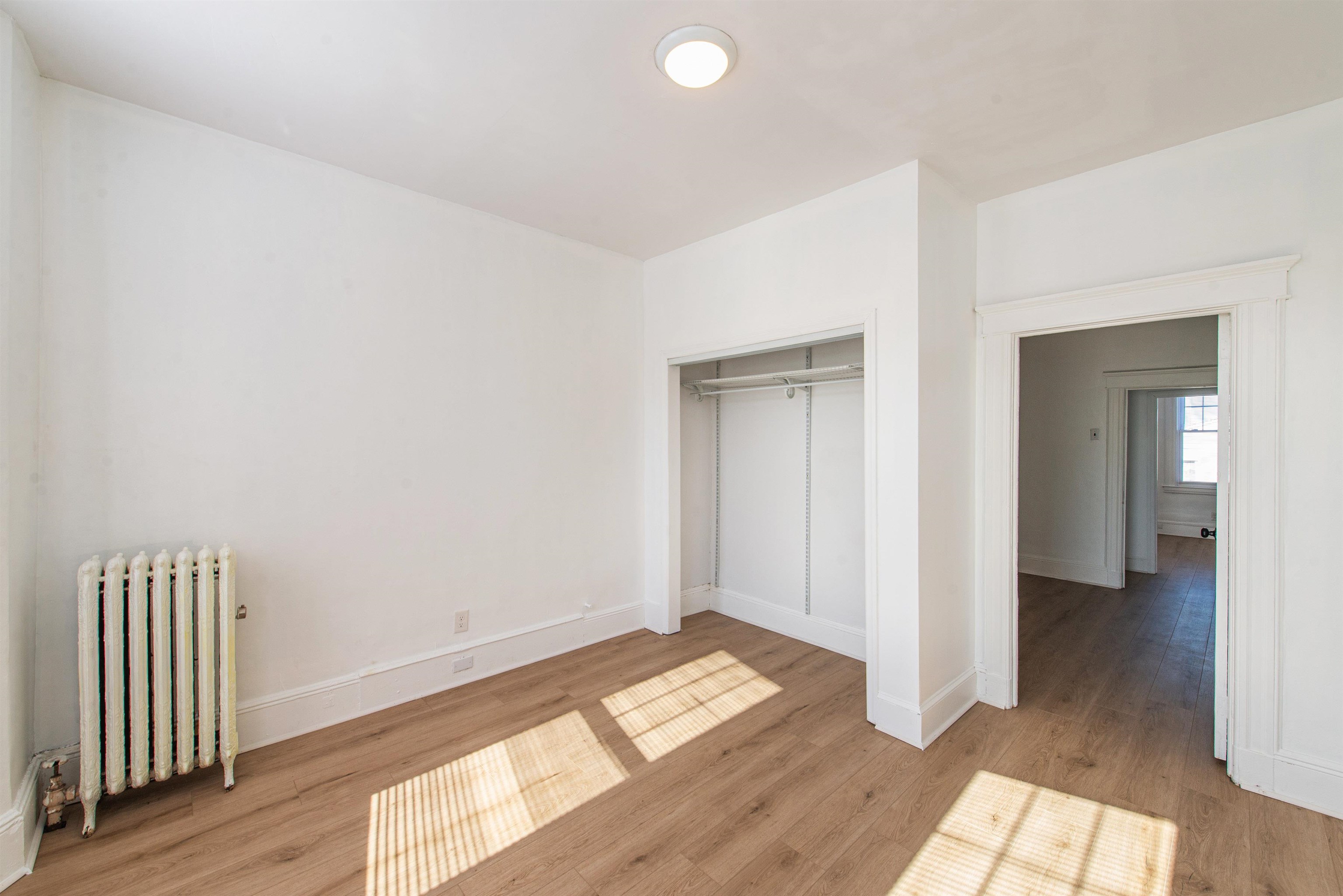 1308 27th Street, Unit 2 North Bergen, NJ 07047 - Photo 8 of 15 wooden floor in a hall with an entryway