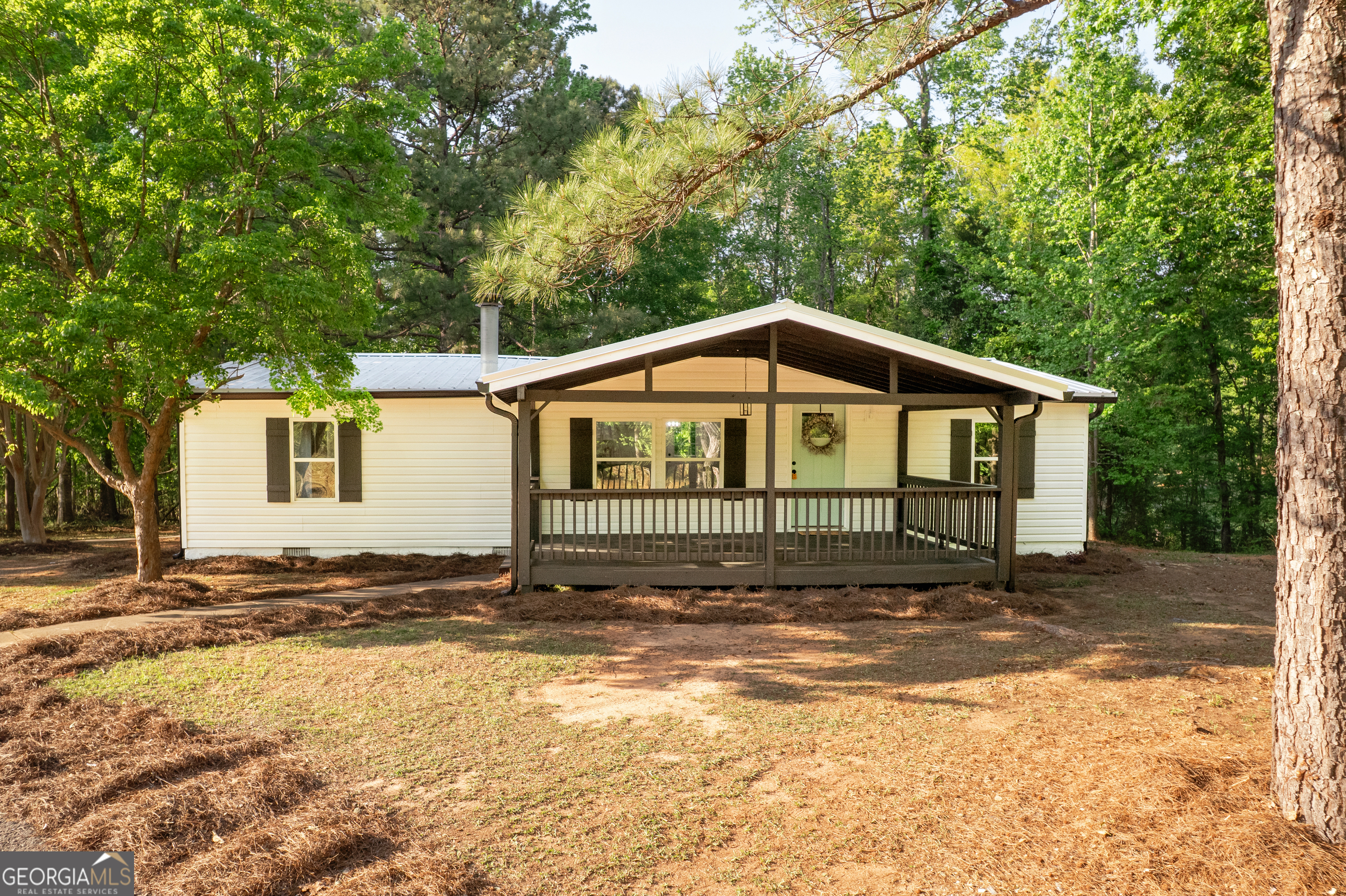 216 Howard Road Barnesville, GA 30204 - Photo 1 of 1 a view of a house with a yard