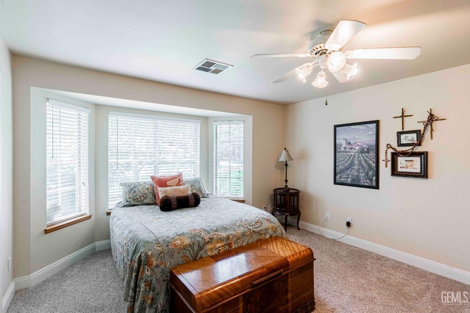 Undisclosed Address Bakersfield, CA 93314 - Photo 41 of 67 a bedroom with a large bed and a window