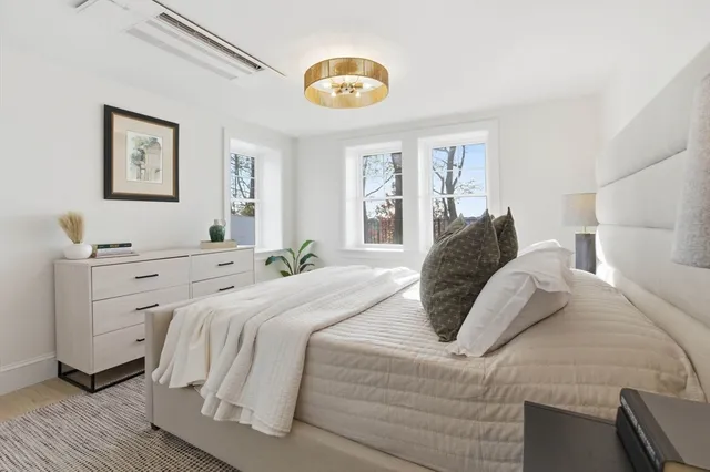 a bedroom with a bed and a cabinets