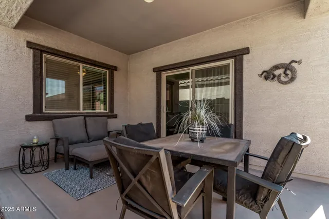a dining room with furniture and window