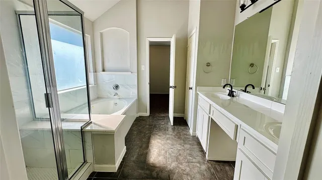 a bathroom with a double vanity sink and a mirror