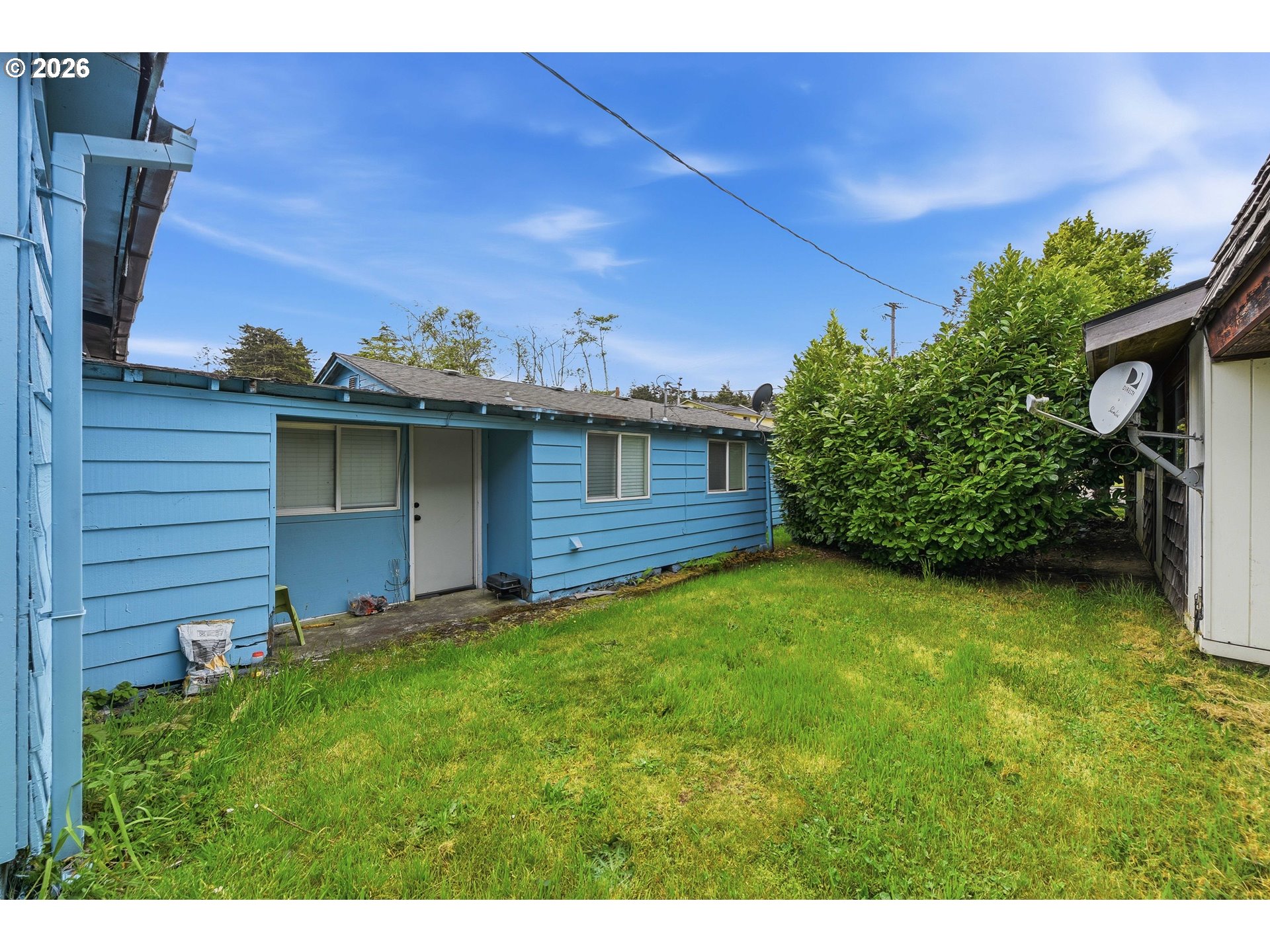 1955 Maple Street North Bend, OR 97459 - Photo 29 of 48 a view of a backyard with potted plants