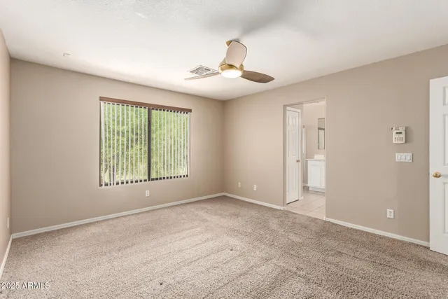 a view of a big room with carpet