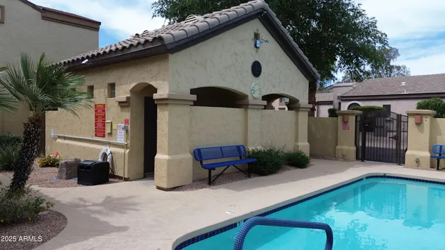 a view of a swimming pool with a patio