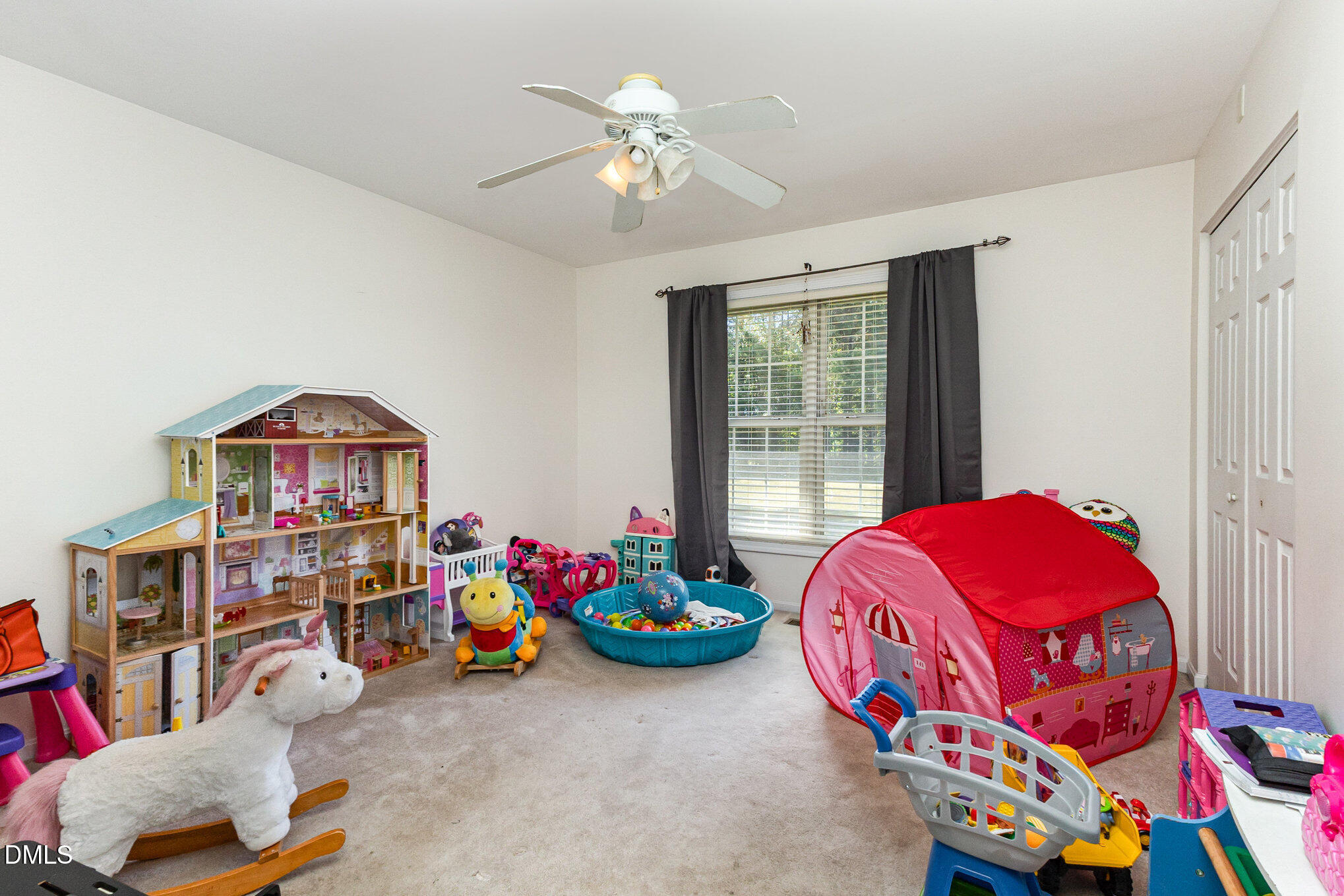 376-t K T K Allen Road Louisburg, NC 27549 - Photo 17 of 39 a living room with baby toys and a chandelier