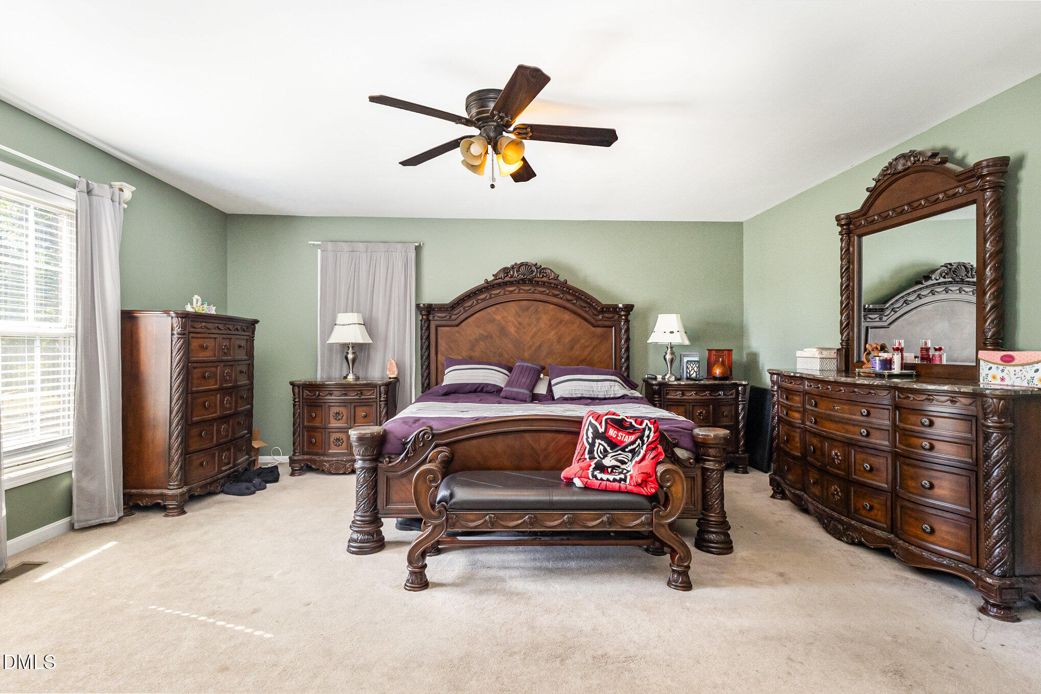 376-t K T K Allen Road Louisburg, NC 27549 - Photo 18 of 39 a bedroom with a bed and a chandelier