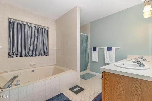 a bathroom with a bathtub and a sink