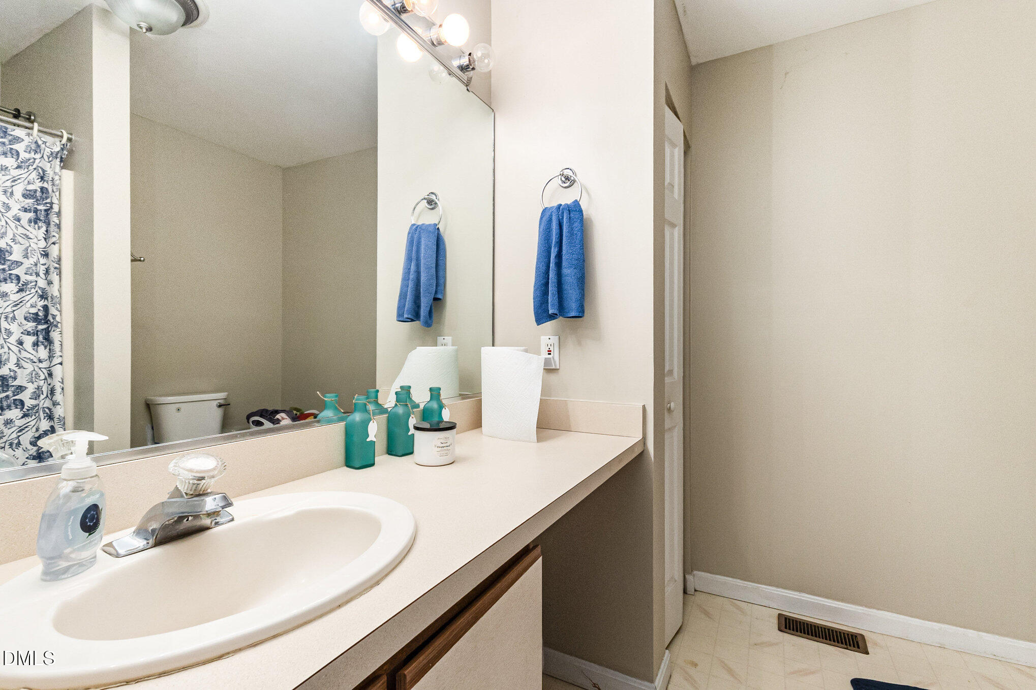 376-t K T K Allen Road Louisburg, NC 27549 - Photo 20 of 39 a bathroom with a sink and a mirror