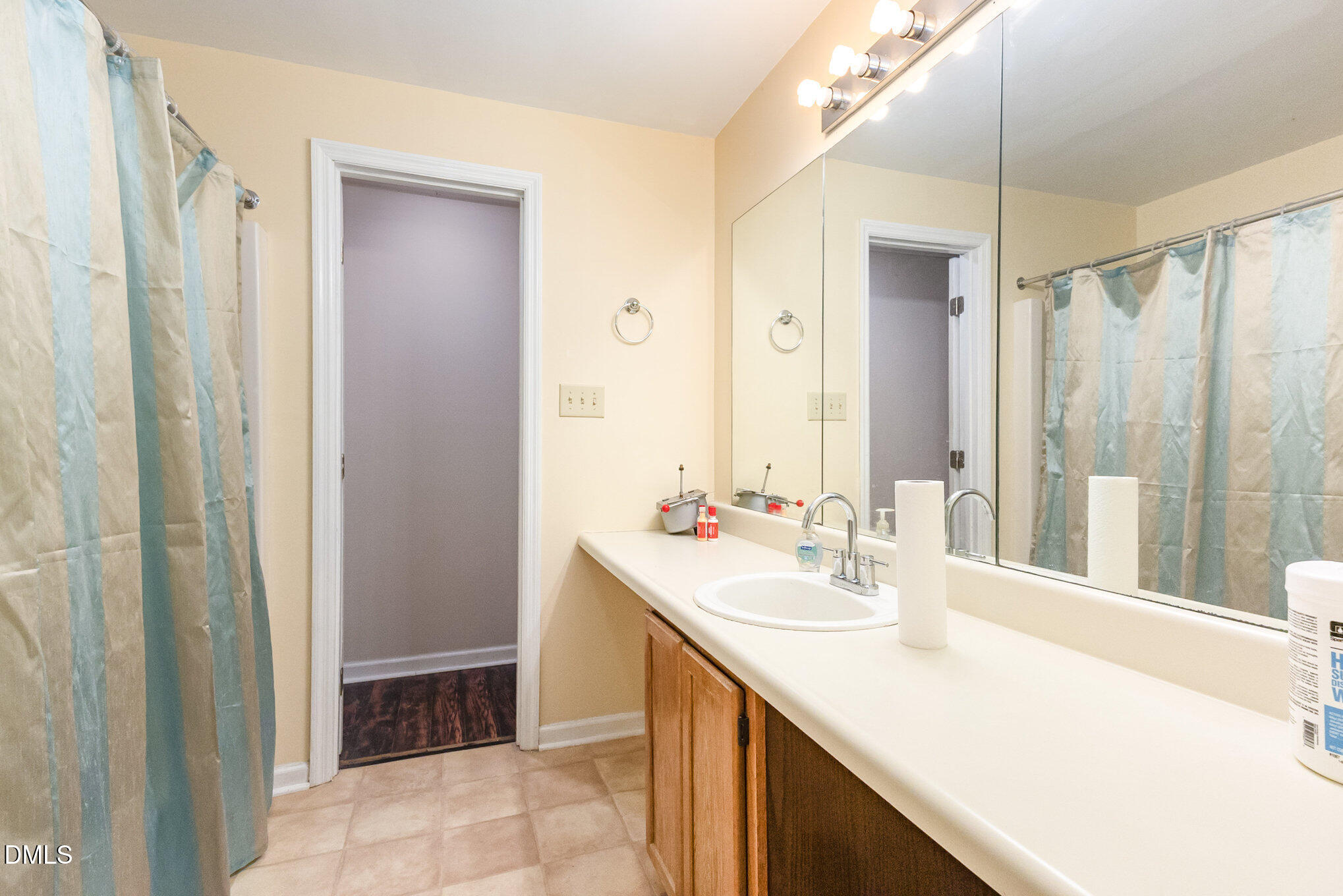 376-t K T K Allen Road Louisburg, NC 27549 - Photo 26 of 39 a bathroom with a sink and a mirror
