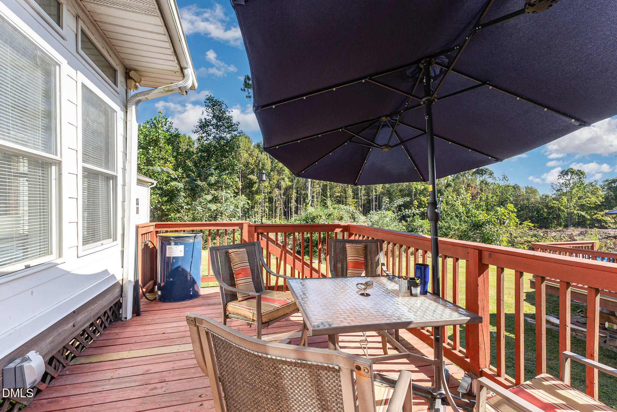 376-t K T K Allen Road Louisburg, NC 27549 - Photo 28 of 39 a view of balcony with furniture and umbrella