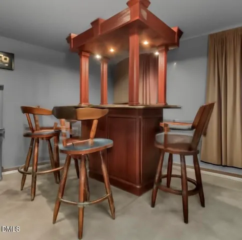 a workspace room with furniture and window