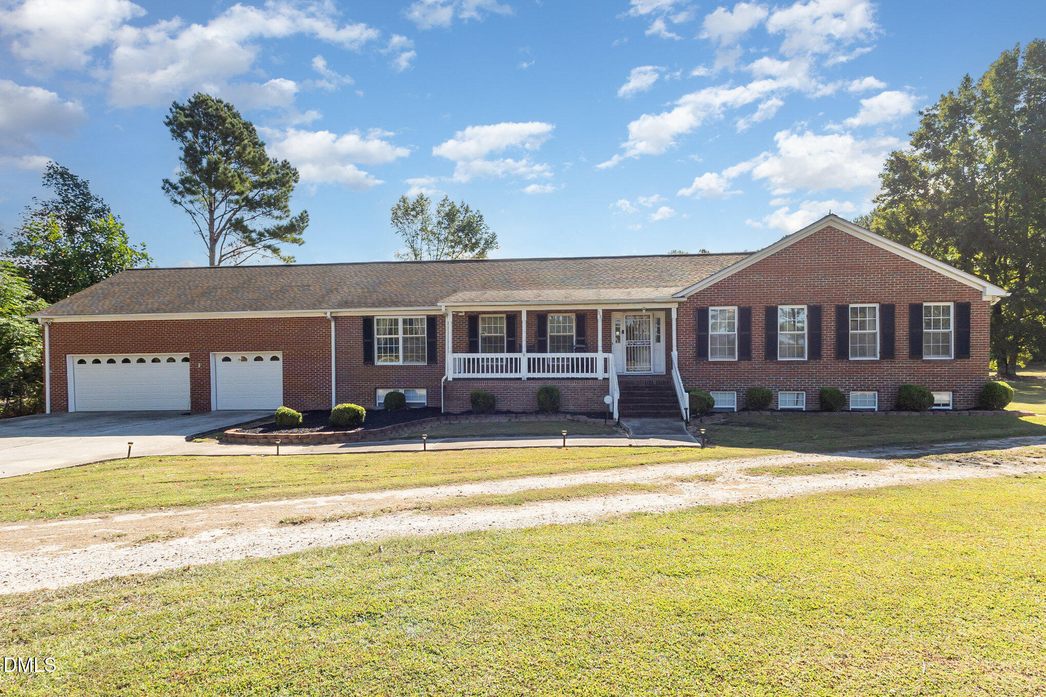 376-t K T K Allen Road Louisburg, NC 27549 - Photo 4 of 39 a view of a large building with a swimming pool and lawn chairs under an umbrella