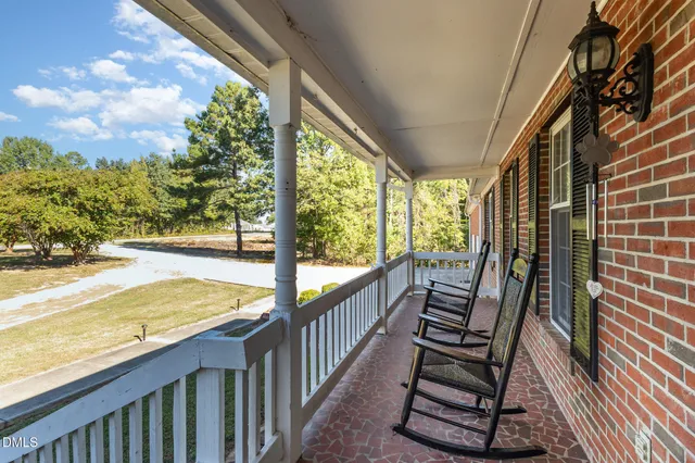 a view of balcony with wooden floor and outdoor space
