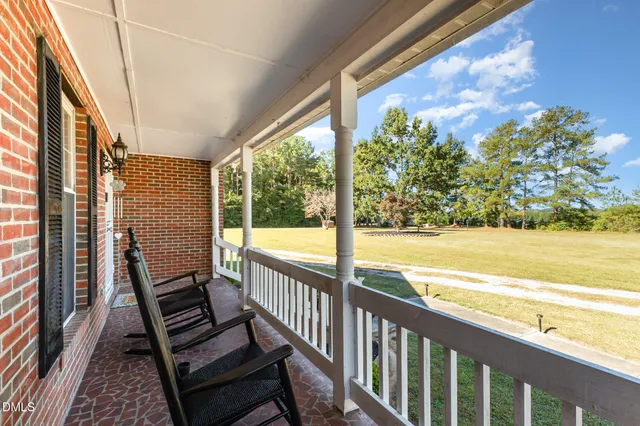 a view of a balcony with ocean view