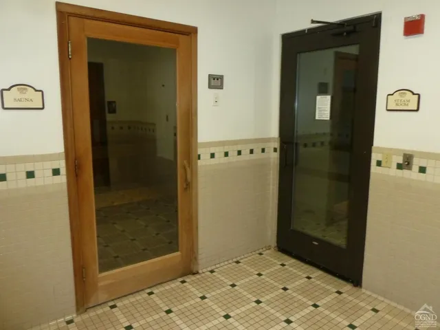 a view of a hallway with a bathroom