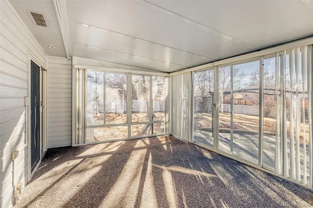 a view of a room with large windows