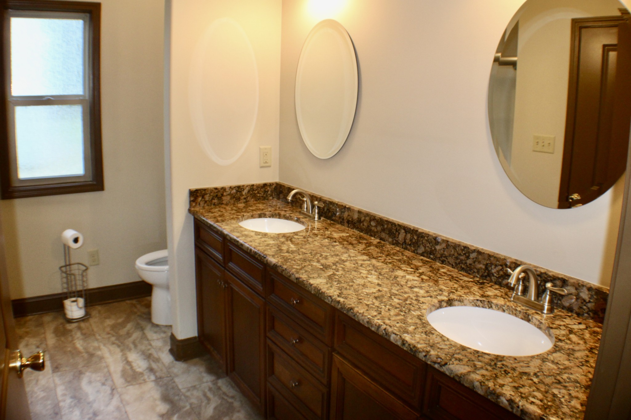 935 Lakeview Drive Collierville, TN 38017 - Photo 38 of 82 a bathroom with a granite countertop sink and a mirror
