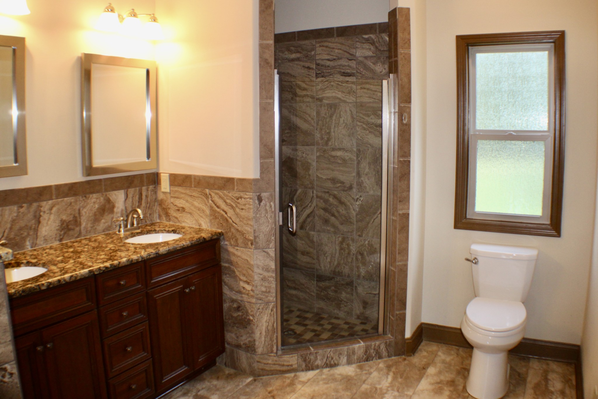 935 Lakeview Drive Collierville, TN 38017 - Photo 43 of 82 a bathroom with a granite countertop sink a toilet and shower