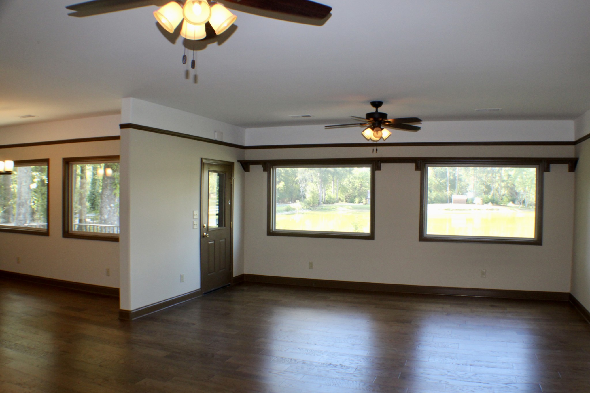 935 Lakeview Drive Collierville, TN 38017 - Photo 50 of 82 a view of an empty room with wooden floor and a window