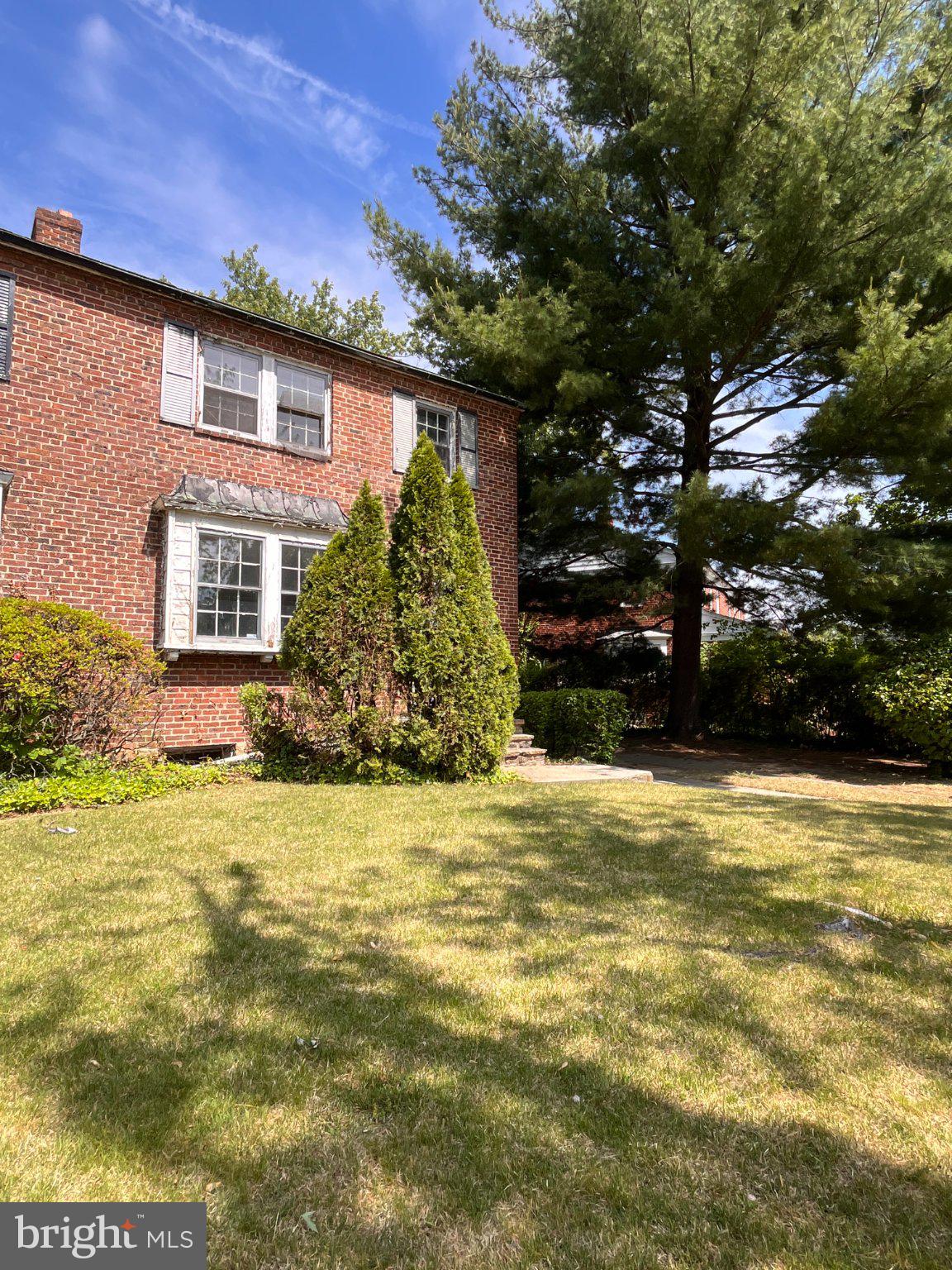 5906 Ayleshire Road Baltimore, MD 21239 - Photo 30 of 41 Charming brick home with lush greenery.