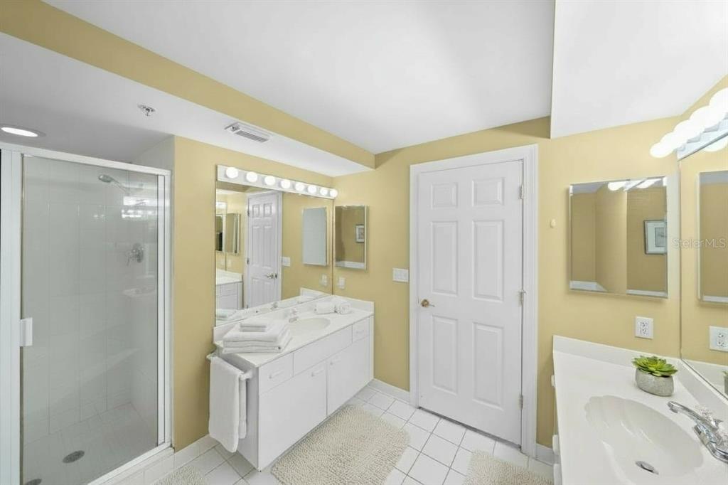 4575 South Atlantic Avenue, Unit 6209 Ponce Inlet, FL 32127 - Photo 15 of 31 a bathroom with a tub sink shower and mirror
