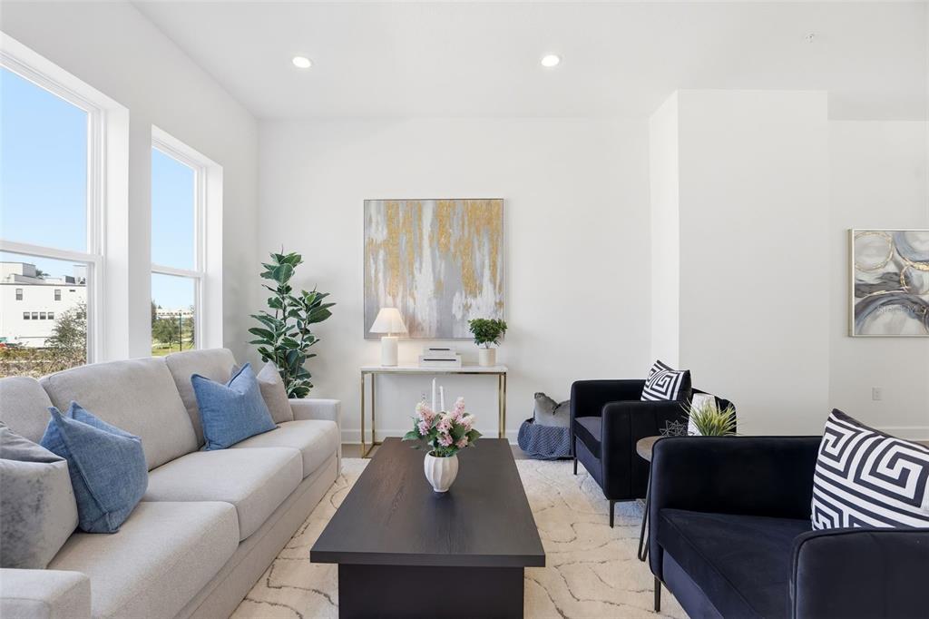 2174 Whitney Marsh Alley Orlando, FL 32804 - Photo 12 of 50 a living room with furniture and a large window