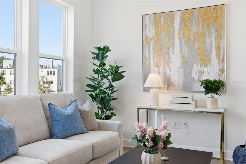2174 Whitney Marsh Alley Orlando, FL 32804 - Photo 13 of 50 a living room with furniture and flowers