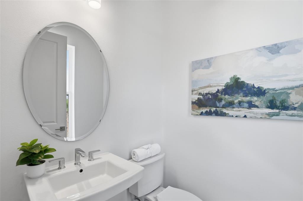 2174 Whitney Marsh Alley Orlando, FL 32804 - Photo 15 of 50 a bathroom with a sink mirror and toilet