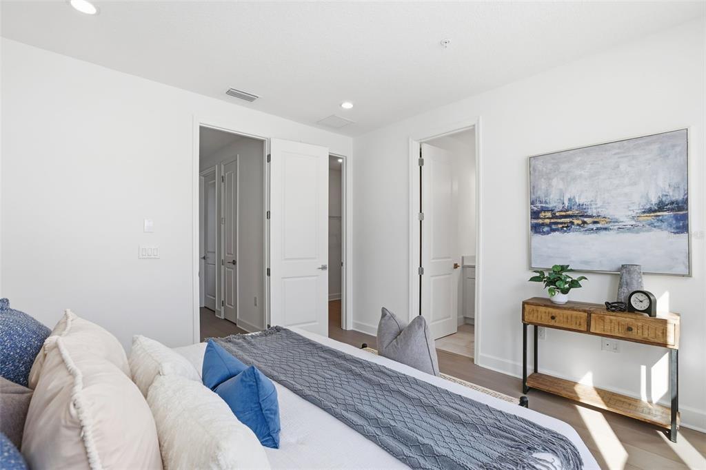 2174 Whitney Marsh Alley Orlando, FL 32804 - Photo 19 of 50 a bedroom with a bed and a dresser