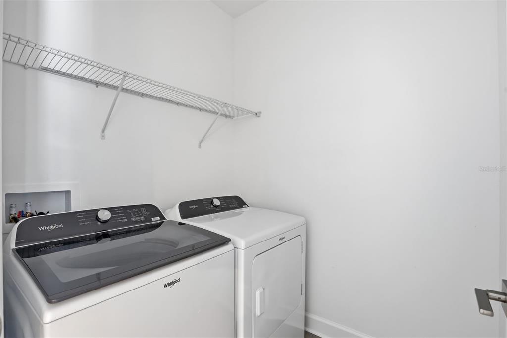 2174 Whitney Marsh Alley Orlando, FL 32804 - Photo 21 of 50 a utility room with dryer and washer