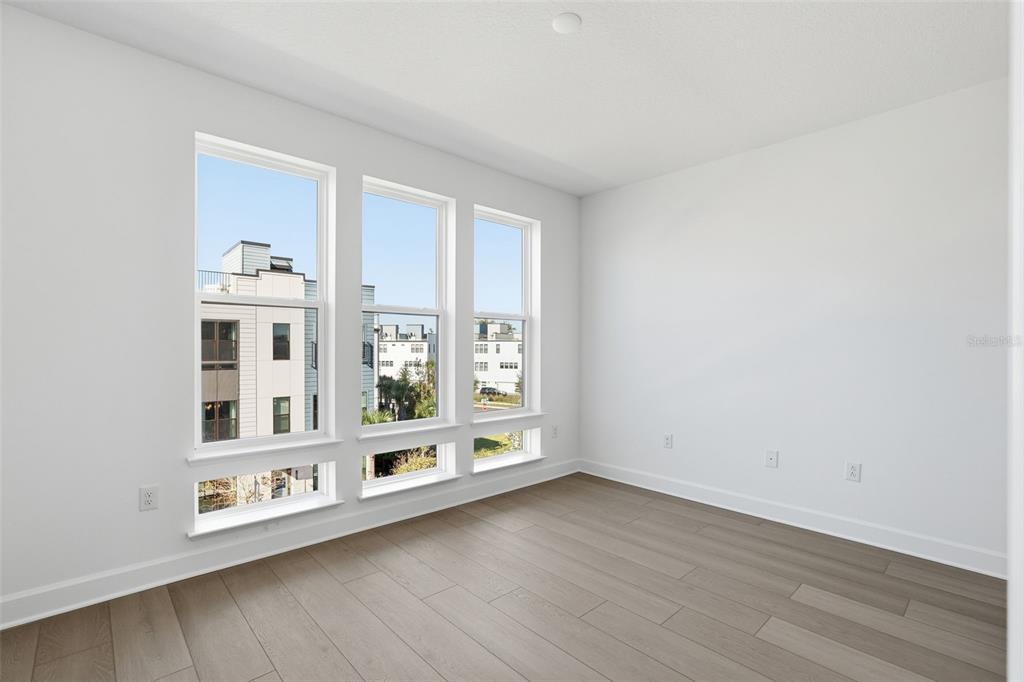 2174 Whitney Marsh Alley Orlando, FL 32804 - Photo 22 of 50 a view of an entryway with wooden floor and windows