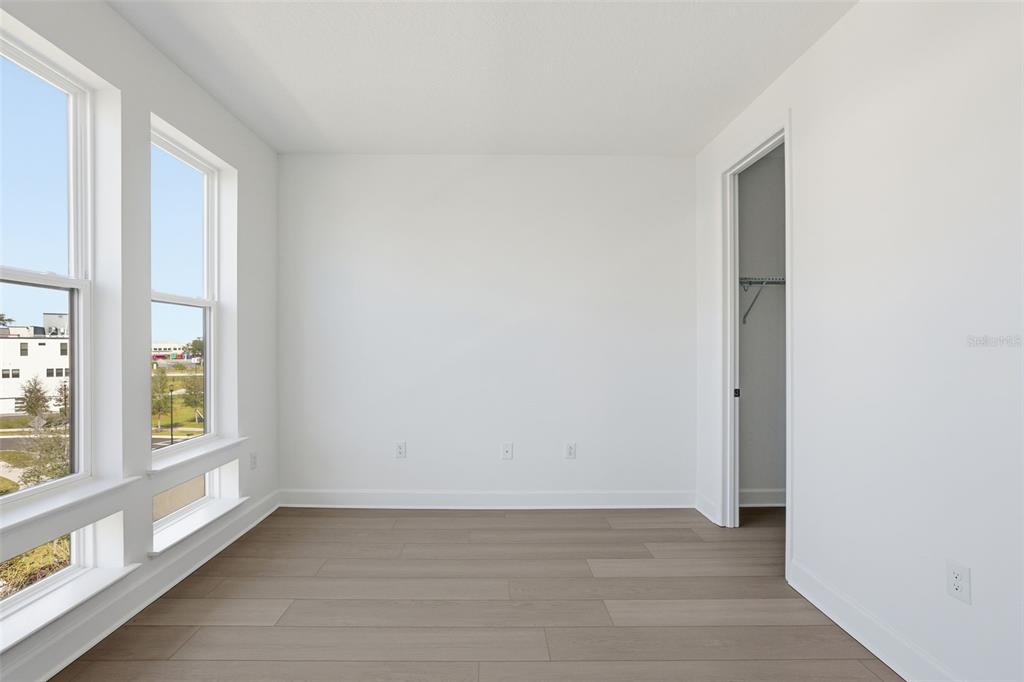 2174 Whitney Marsh Alley Orlando, FL 32804 - Photo 23 of 50 a view of an empty room with a window