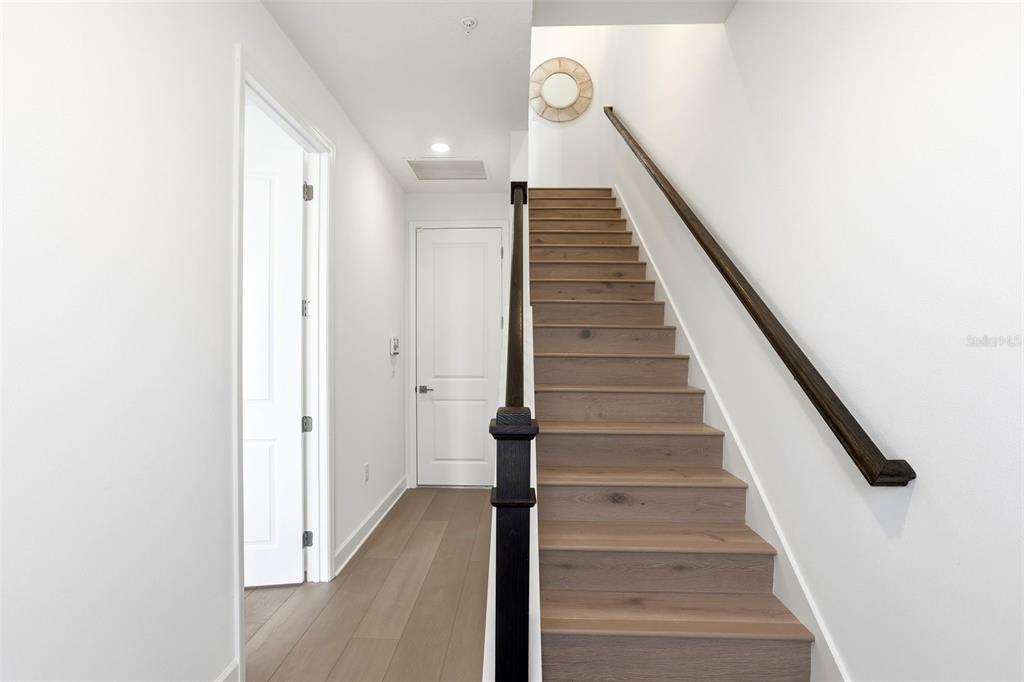 2174 Whitney Marsh Alley Orlando, FL 32804 - Photo 4 of 50 a view of entryway and gallery with wooden floor