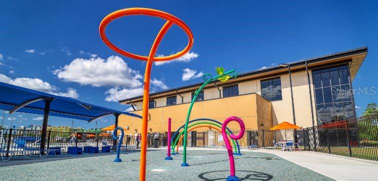2174 Whitney Marsh Alley Orlando, FL 32804 - Photo 50 of 50 a group of people sitting under a large umbrella