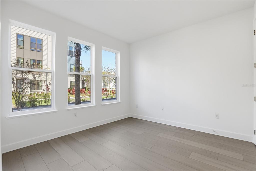 2174 Whitney Marsh Alley Orlando, FL 32804 - Photo 5 of 50 an empty room with windows