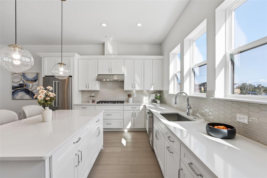 2174 Whitney Marsh Alley Orlando, FL 32804 - Photo 9 of 50 a kitchen with a sink stove and cabinets