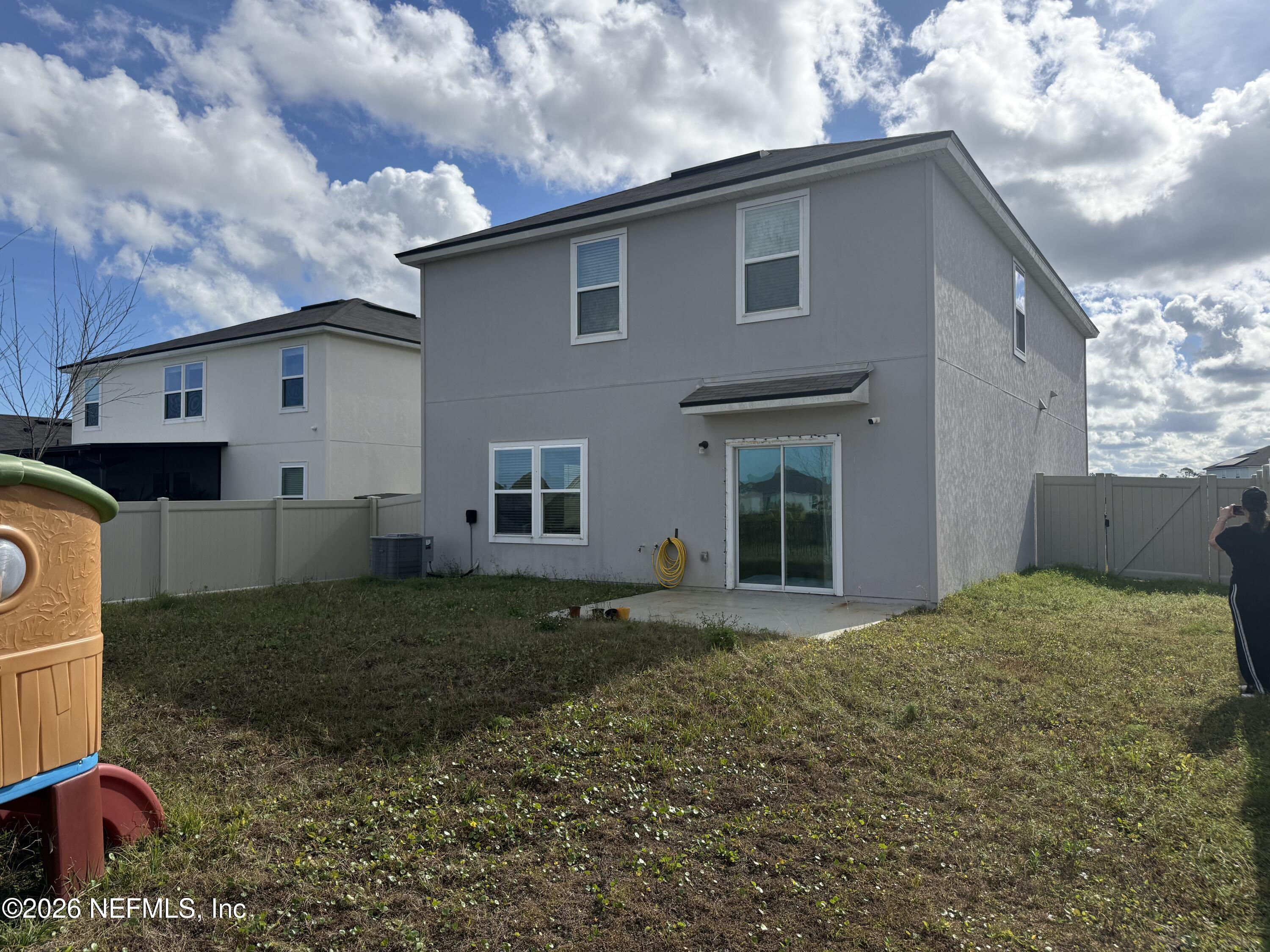 150 Aveiro Way Street St. Augustine, FL 32084 - Photo 39 of 68 a front view of a house with a garden