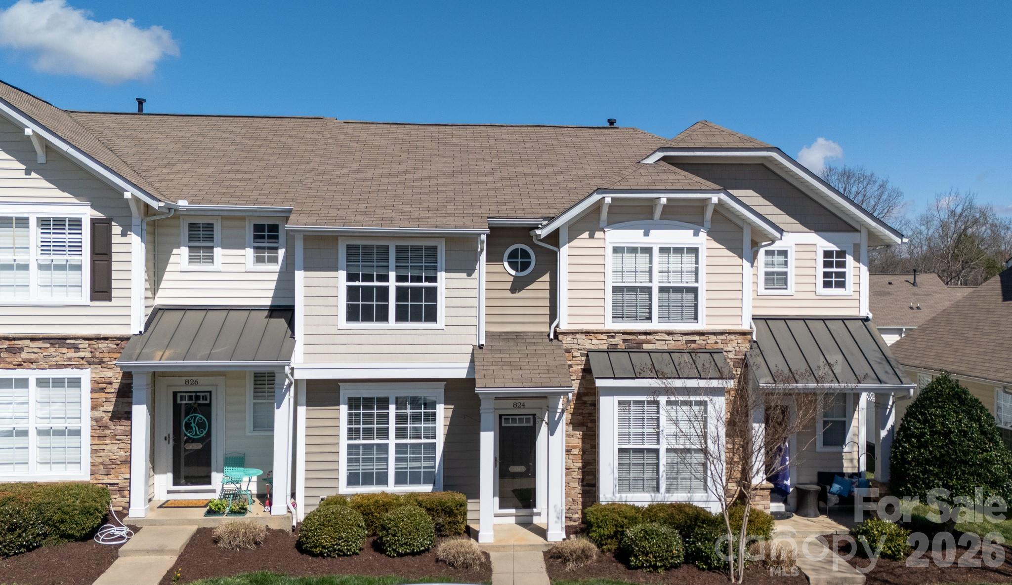a front view of a house with balcony