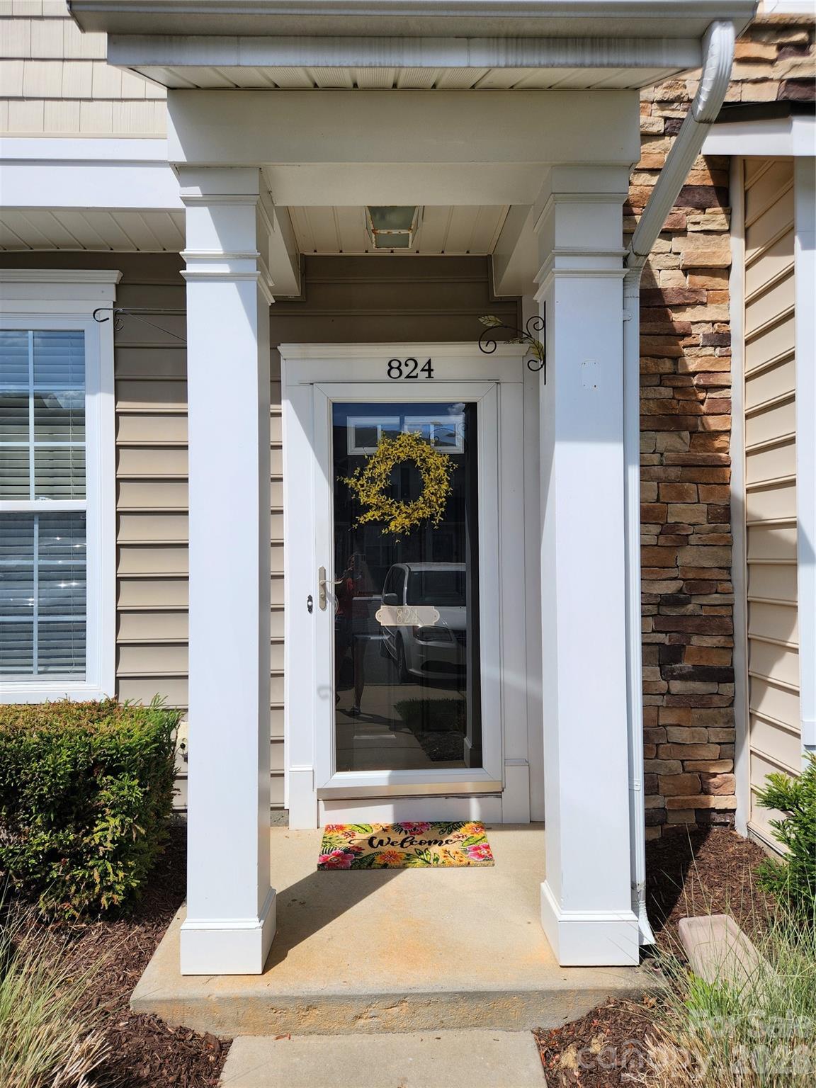 824 Gentlewinds Court Fort Mill, SC 29708 - Photo 4 of 30 a front view of a house with a garage