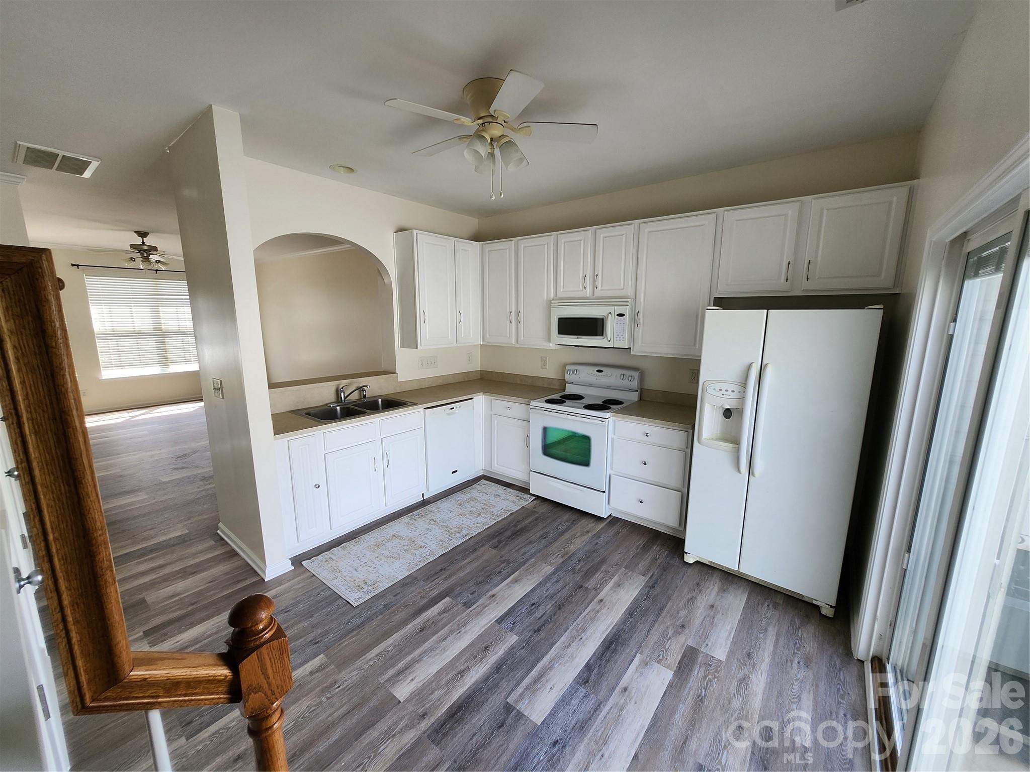 824 Gentlewinds Court Fort Mill, SC 29708 - Photo 9 of 30 a kitchen with granite countertop a refrigerator a sink dishwasher a stove top oven a refrigerator with island and cabinets